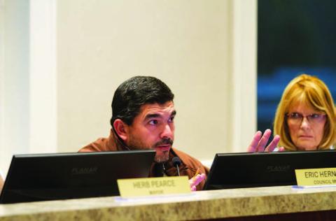 Lampasas City Councilman Eric Hernandez questions the 2Q Ranch Productions representative about its request for hotel-motel tax funding for upcoming events. Also pictured is Councilwoman Dorothy Person. HUNTER KING | DISPATCH RECORD