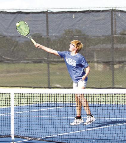Jack Allison volleys the ball at the net against Glen Rose. HUNTER KING | DISPATCH RECORD
