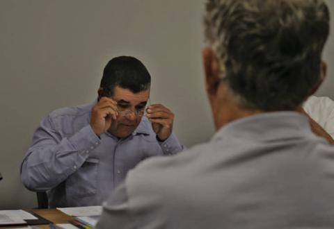 Lampasas Central Appraisal District board member Chris Harrison reviews figures presented in the proposed budget for 2025. LCAD directors discussed the detailed proposal at their meeting last week and ultimately trimmed some requests to make the budget more acceptable to the taxing entities in its jurisdiction. ERICK MITCHELL | DISPATCH RECORD