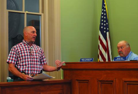 Sheriff David Parker, at left, addresses Commissioner Mark Rainwater and others on the Commissioners Court to offer details on a new jail agreement to house San Saba County inmates at the Lampasas County Jail. ERICK MITCHELL | DISPATCH RECORD