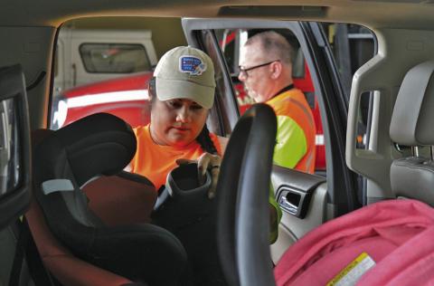 Texas Department of Transportation-certified child passenger safety technicians ensured each child car seat was installed correctly during Thursday’s event at the Lampasas Fire Department Station on Fourth Street. ERICK MITCHELL | DISPATCH RECORD