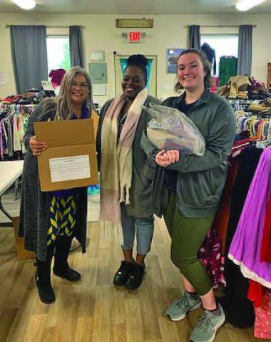 JoAnn Mensch, at left, Shavonne McClendon and Lilian Stephen pause for a photo inside the New Beginning of Restoration Beginning and Hope location. COURTESY PHOTO