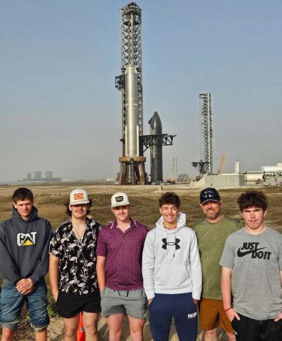 Lometa High School’s drone class got up close and personal with SpaceX’s eighth Starship flight test rocket. The group was able to view the rocket from a few hundred yards away. Pictured left to right are Stone Carr-Jones, Lukas Smailus-Cruz, Colten Whitehead, Ivan Oliver, Superintendent Rob Moore and Roy Carr. COURTESY PHOTO