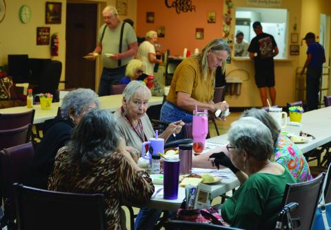 Congregates get ready to dig into their meals Tuesday at the Lampasas Senior Center. The center is seeking more donations for its Meals on Wheels program as 31 seniors are currently waitlisted to be served. ERICK MITCHELL | DISPATCH RECORD
