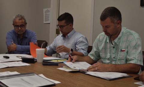 Looking over 2026 budget numbers for the Lampasas Central Appraisal District are, from left, Chief Appraiser Juan Saucedo, MVBA Law managing attorney Nicholas Goettsche and LCAD Board Chairman Marshal Brewer. ERICK MITCHELL | DISPATCH RECORD