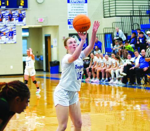 Kari Kepler shoots a free throw for one of her 10 points in the contest. HUNTER KING | DISPATCH RECORD