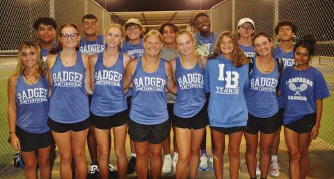 COURTESY PHOTO | KENNETH PEISER The tennis team poses for a photo after claiming the district championship on Tuesday night.