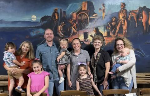 Paula Cantrell Landers, standing second from the right, was joined by her extended family in front of the mural painted by her father, the late Cliff Cantrell. COURTESY PHOTO