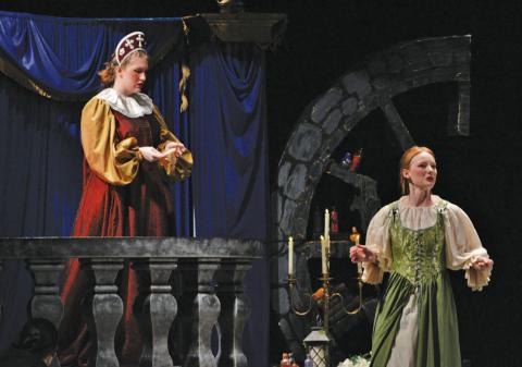 At left, Samantha Sturgeon as “Melibea” and Kenzie Stone as “Lyse” carry out a scene from the “The Illusion” in a Monday performance that served as prep for Wednesday’s competition. ERICK MITCHELL | DISPATCH RECORD