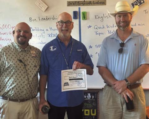 Lampasas High School has named Bob Davis, center, its Teacher of the Month for August. Assistant Principal Ryan Race, at left, said Davis “is an amazing English I and General Employability teacher. He shows what a good teacher looks like with his calm demeanor and great relationships with his students.” Clay Phillips of Texas Farm Bureau Insurance also was on hand to recognize Davis. COURTESY PHOTO