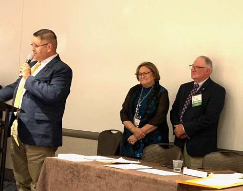 Pictured from left to right are T.J. Verver, Farm Bureau field director, who introduced Lampasas County Farm Bureau member and outgoing TFB Director Mickey Edwards and his wife Janie at the District 8 Caucus held during the annual Texas Farm Bureau state conference in Round Rock. courtesy photo