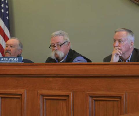 Commissioners Court members, from left to right, Precinct 4 Commissioner Mark Rainwater, Precinct 3 Commissioner Lewis Bridges and County Judge Randy Hoyer listen to comments during Monday’s meeting. erick mitchell | dispatch record