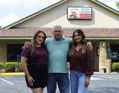 Alfredo Suarez stands with daughters Arleny, left, and Valeria outside his restaurant on U.S. Highway 281 South. The family-owned business takes pride in treating customers like they are special kinfolk, too. The Mexican restaurant will host a twoday celebration next week in honor of its 20 years of operation in Lampasas. ERICK MITCHELL | DISPATCH RECORD