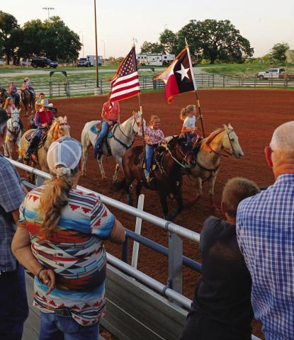 Competitors in the Lampasas Junior Rodeo circle the arena for the Grand Entry to open the evening’s activities on Friday. Lampasas Riding Club hosted the two-night event last weekend at the 580 Sports Complex rodeo arena. COURTESY PHOTO