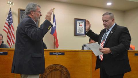 Gene Isenhour, at left, affirms his oath of office for a second term as the city’s municipal judge. Mayor John Wilkerson administered the oath at Tuesday night’s Kempner City Council meeting. ERICK MITCHELL | DISPATCH RECORD