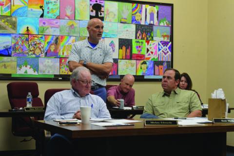Assistant Superintendent Dana Holcomb, standing, provides highlights from the most recent Texas Academic Performance Report to Lampasas ISD trustees. Holcomb, who oversees curriculum matters for the school district, said that in 18 of 20 different STAAR tested areas, students here outperformed their counterparts across the state. ERICK MITCHELL | DISPATCH RECORD