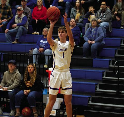 HUNTER KING | DISPATCH RECORD Vincent Shahan shoots a three-point shot during a game earlier this season.
