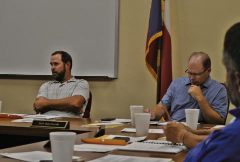 At left, Lampasas ISD Board of Trustees President Ryan Shahan leads discussion at Monday’s meeting as Board Vice President Rob Borchardt looks on. ERICK MITCHELL | DISPATCH RECORD