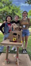 Lampasas High School student volunteers hosted art events at Arts in the Park For Kids last weekend. Elianna Tenorio, Claire Seneca and Daphne Davenport, pictured from left to right, persevered through a windy day last Saturday to create this sculpture piece out of cardboard. The event promotes arts in the community with a special focus on demonstrating many artistic methods to youth. BARBARA HAGLE | COURTESY PHOTO