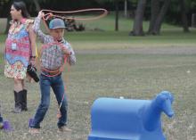 Hanna Springs second-grade student Holt Bumpus practices his lasso skills during Ag Safety Day on Friday. ERICK MITCHELL | DISPATCH RECORD