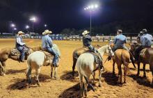 At far left is CPRA judge Bill Herbert, a former four-time CPRA saddle bronc champion. He awaits with entrants for the start of the team roping event at the 2023 Riata Roundup Rodeo held at the 580 West Sports Complex in Lampasas. file photo
