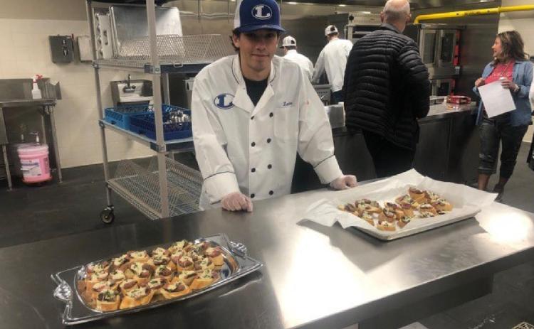Culinary student Landon DiBattiste shows off his dish for competition. COURTESY PHOTO