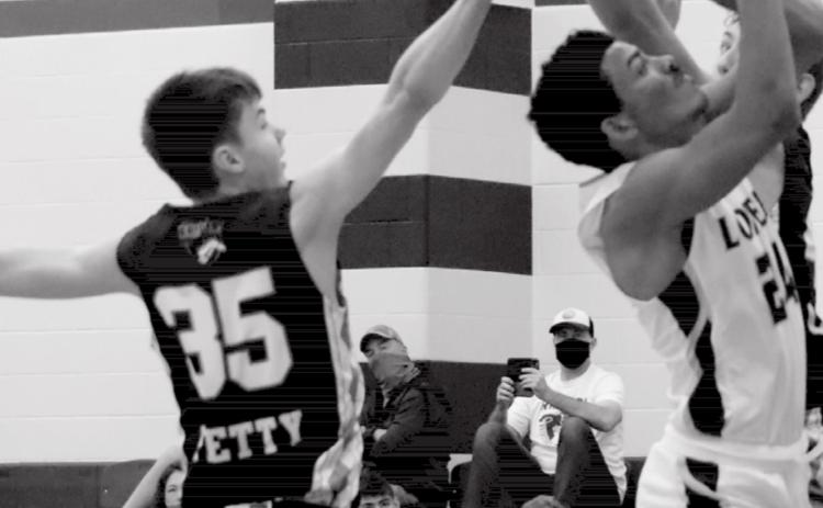 Dyllen Workmon, far right, shoots in close coverage in Tuesday’s non-district game. EMILY ANDRADE | LOMETA ISD YEARBOOK