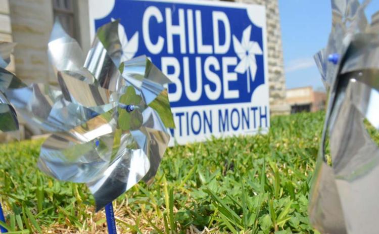 Pinwheels outside the county courthouse draw attention to National Child Abuse Prevention Month. MONIQUE BRAND | DISPATCH RECORD