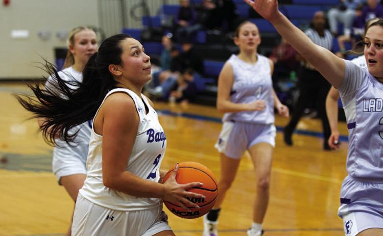 Johnnie Lewis drives to the basket for a layup against Florence. HUNTER KING | DISPATCH RECORD