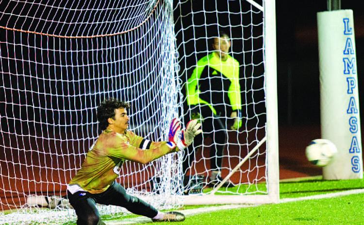 HUNTER KING | DISPATCH RECORD Michael Clayton dives to save a penalty kick against the Brownwood Lions last Friday night.