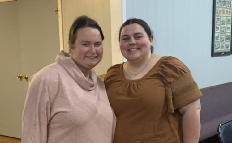 Holly Hines gave a presentation on how to use the app GroupMe, which will allow the club to have an easy-to-use group chat. Laura Beth Henniger joined in the festivities. COURTESY PHOTO