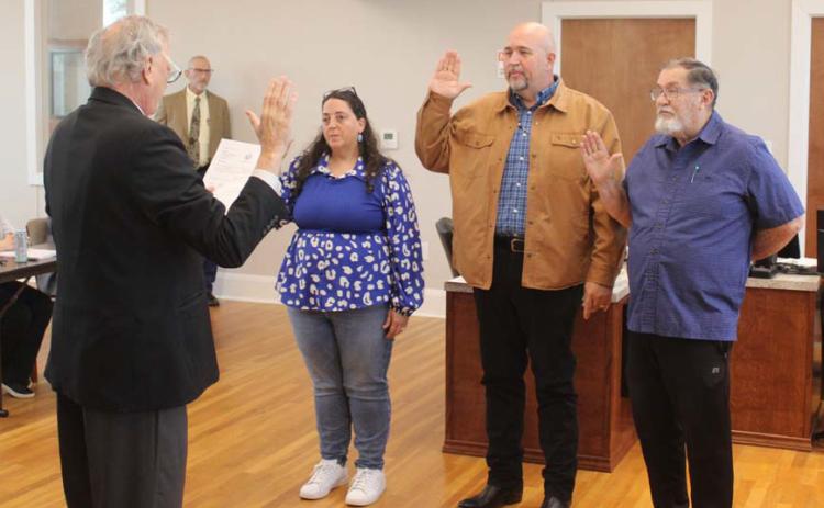 At the May 13 Lampasas City Council meeting, Municipal Court Judge Robert Gradel administered the oath of office to re-elected members Catherine Kuehne, Davis Keele and Chuck Williamson, pictured left to right. courtesy photo | City of Lampasas