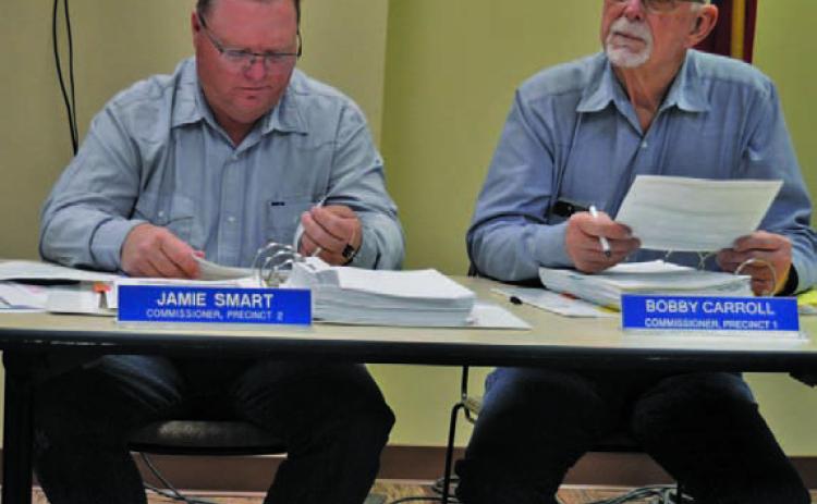 County Commissioners Jamie Smart, left, and Bobby Carroll were on different sides of a vote to rescind the outdoor burn ban. ERICK MITCHELL | DISPATCH RECORD