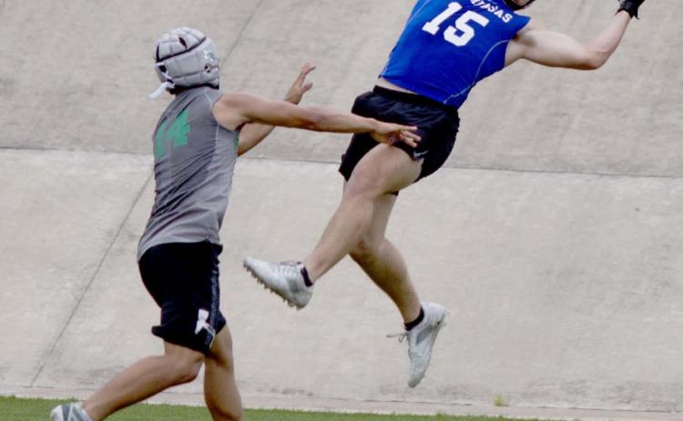 Case Brister hauls in a touchdown pass from Dax Brookreson in 7-on-7 action Monday. Lampasas beat Burnet in the game pictured above and Georgetown East View in the finale. JEFF LOWE | DISPATCH RECORD