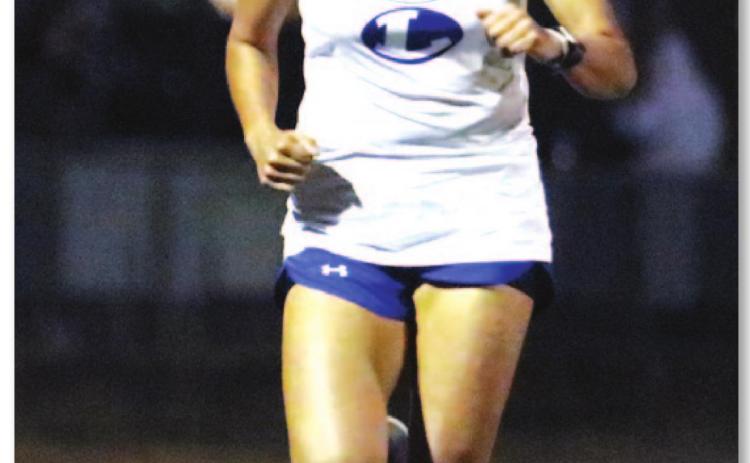 Leilany Alvarez jogs down the track during her long-distance run last Thursday in Llano. BRILEY MITCHELL | COURTESY PHOTO