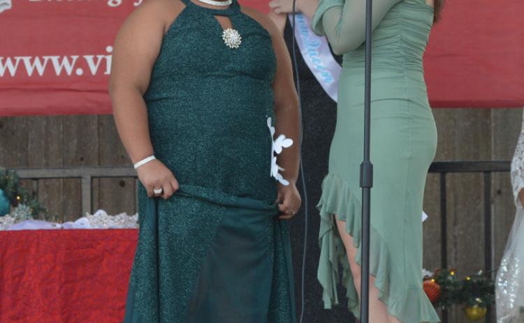 Vera-Rose Johnson, left, is pictured on the Lampasas County Courthouse bandstand in December after taking the Snow Queen title. She will comete in a state pageant this weekend, hosted by the National American Miss organization. file photo