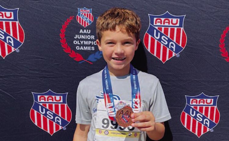 Vion Miller poses with his medal from the AAU Junior Olympics. COURTESY PHOTO