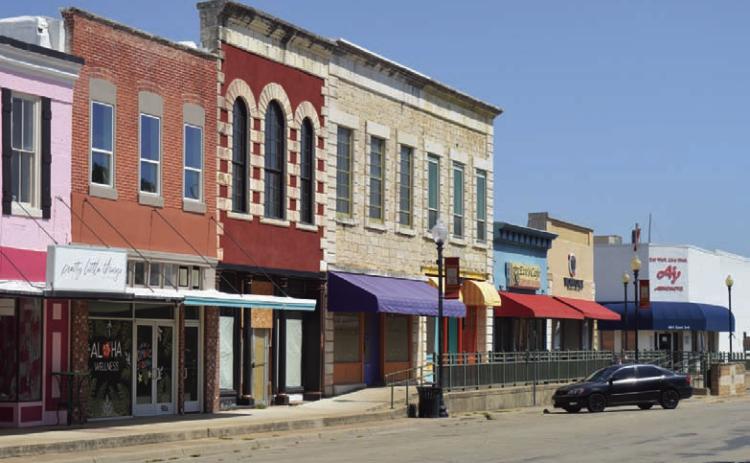 A number of downtown business sites sit vacant along East Third Street. Building owners are considering their options for attracting more visitors -- and potential customers -- to the area. DISPATCH RECORD