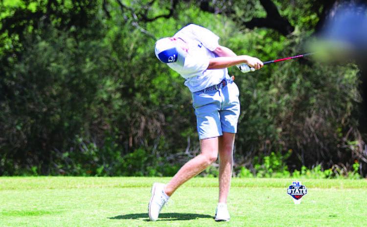 Riley Oestreich swings through a tee shot during the second day of the state golf tournament on Tuesday. HUNTER KING | DISPATCH RECORD