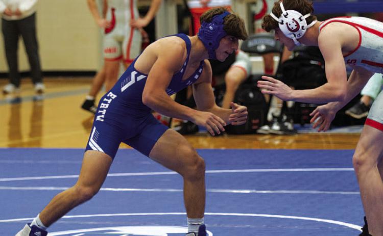 Cole Warren sizes up his opponent during last Wednesday’s wrestling meet. HUNTER KING | DISPATCH RECORD