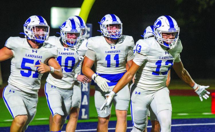 The Badgers’ defense, including Rylan Chapa (13), Campbell Roberts (51), Brayden Roberts (11) and Colton Harper (10) celebrate scoring a safety against Central Catholic before halfimte, the two points that allowed the Badgers to prevail before the game was canceled due to weather. ANA SOFIA MEYER | DISPATCH RECORD
