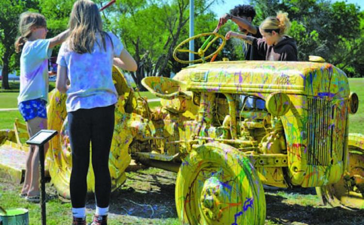 FILE PHOTO At the 2023 Arts in the Park for Kids festival, visitors were encouraged to help repaint a tractor in Campbell Park.