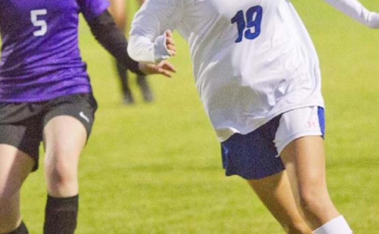 Koral Amador brings the ball downfield in a district match at Florence on Monday. JEFF LOWE | DISPATCH RECORD