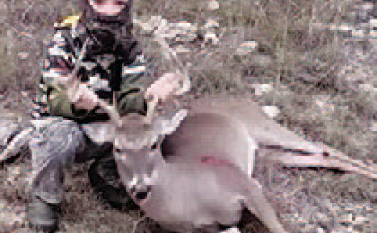 Eight-year-old Gauge Downing killed this buck with his crossbow in Lampasas County. COURTESY PHOTO