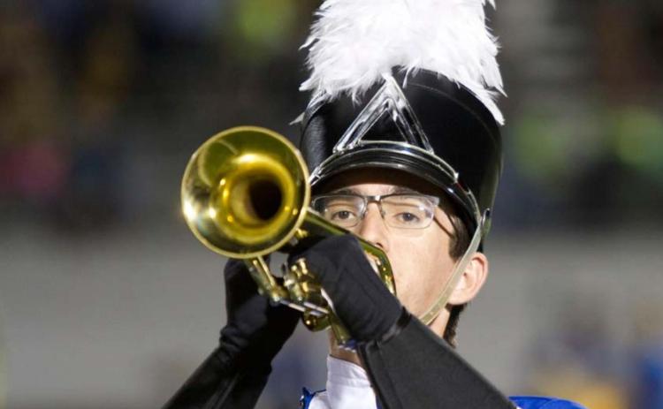 Senior Travis Calk is among the upperclassmen in the Badger Band. He is shown here playing the trumpet during a halftime performance of “The Witching Hour.” hunter king | Dispatch Record