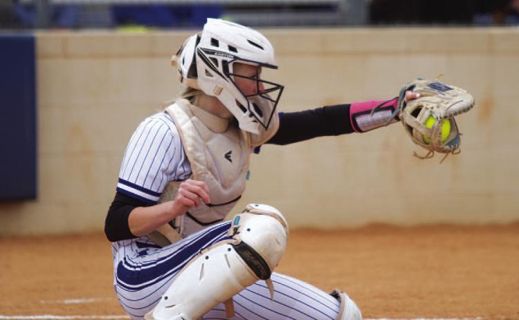 Kali Hunter frames a pitch during the Tuesday win over the Lago Vista Lady Vikings. HUNTER KING | DISPATCH RECORD
