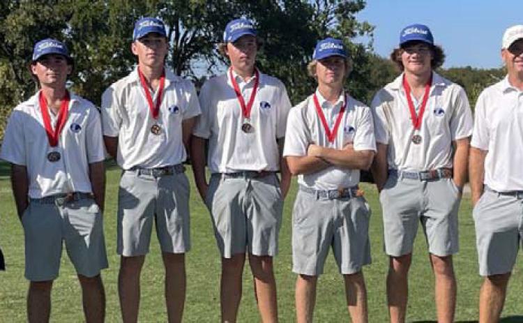 COURTESY PHOTO | GARRY SPORE Members of the Badger golf team pose with their second-place medals.
