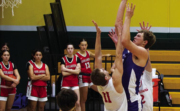 Beau Patterson goes up through contact. He was an all-tournament player last weekend. HUNTER KING | DISPATCH RECORD