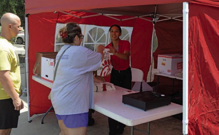 Chick-fil-A’s mobile service assists a customer during its first day of operations in Lampasas. ERICK MITCHELL | DISPATCH RECORD