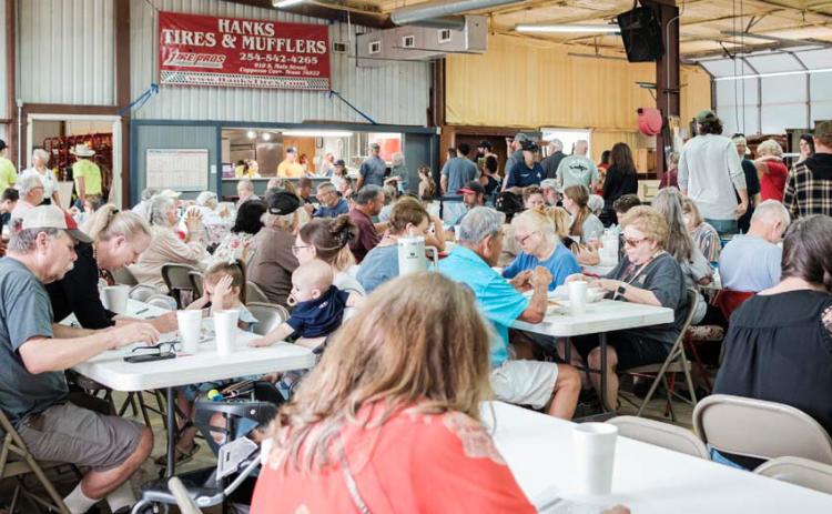 The annual fundraiser event attracts a large crowd of community members with barbecue and unique auction items. The fundraiser accounts for a large part of the department’s revenue each year. File Photo